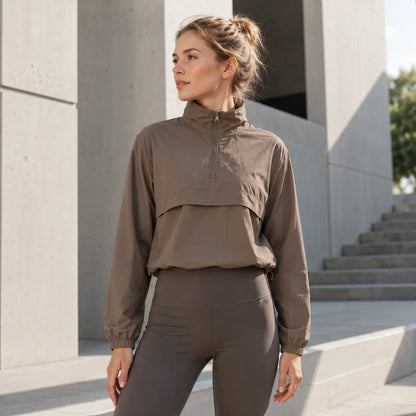 Damen Laufjacke UPF 50+ – Leichte Windjacke mit Viertelreißverschluss